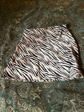 Zebra skirt very silky. Small slit.